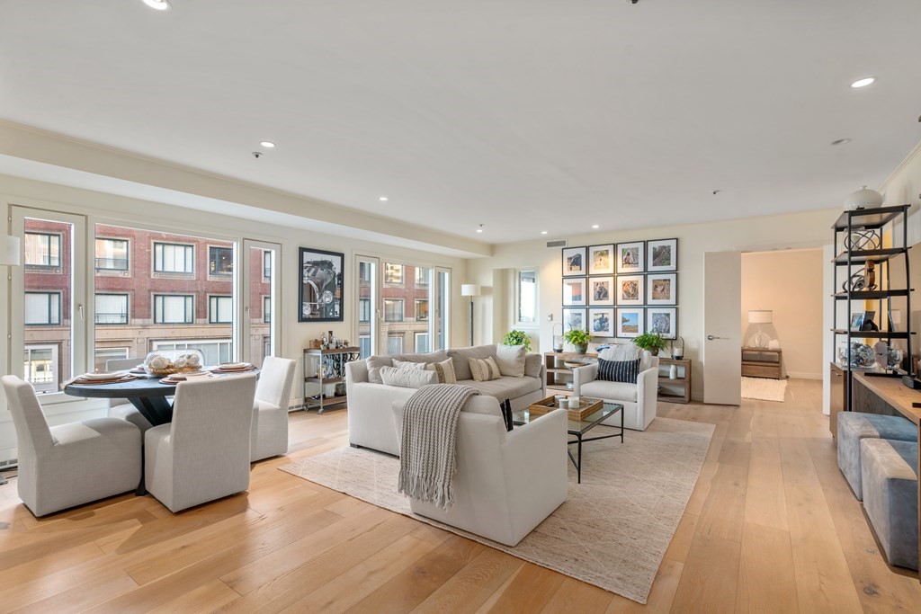 20 Rowes Wharf, Unit 306 Boston, MA 02110 - Photo 2 of 14 a living room with furniture large window and wooden floor