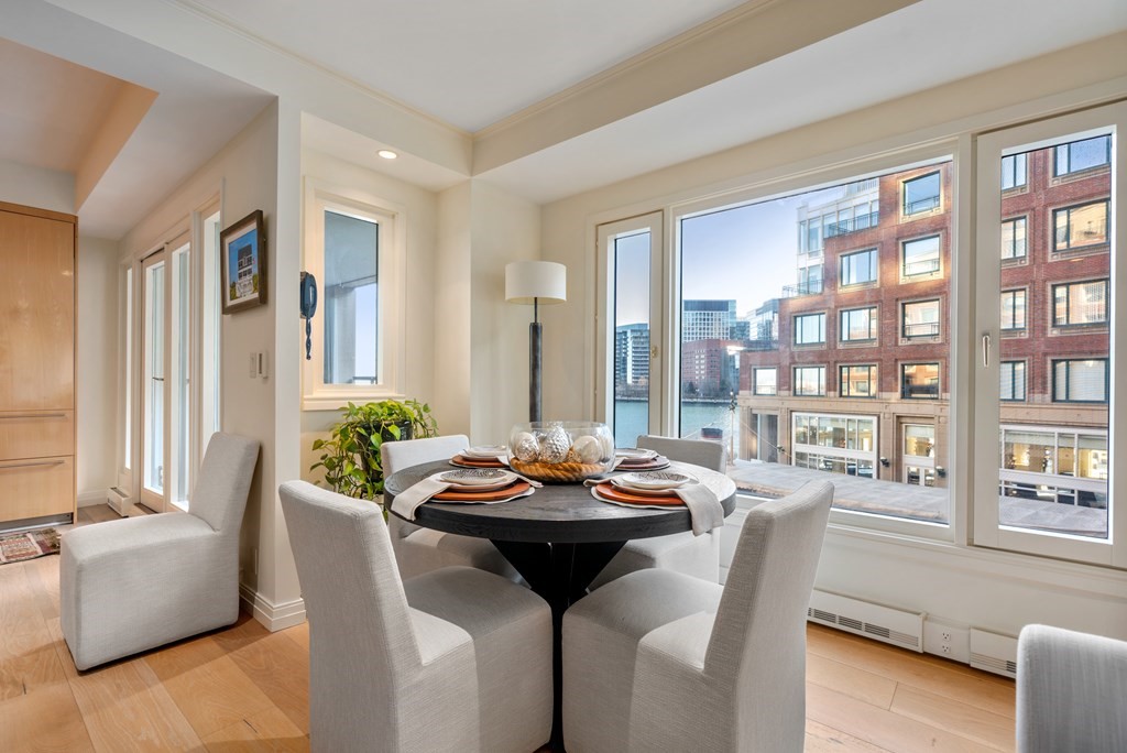 20 Rowes Wharf, Unit 306 Boston, MA 02110 - Photo 7 of 14 a living room with furniture and a potted plant