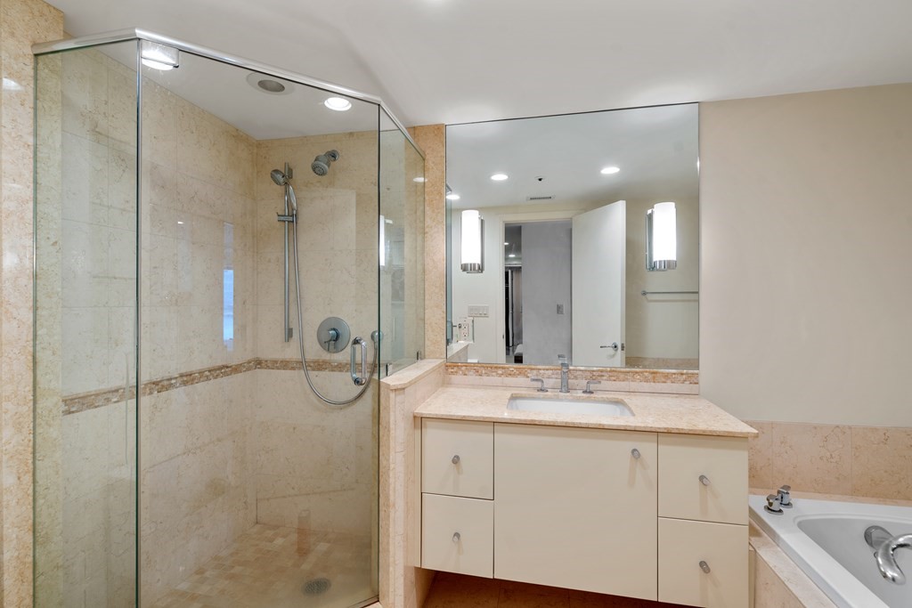 20 Rowes Wharf, Unit 306 Boston, MA 02110 - Photo 10 of 14 a bathroom with a granite countertop sink mirror and double