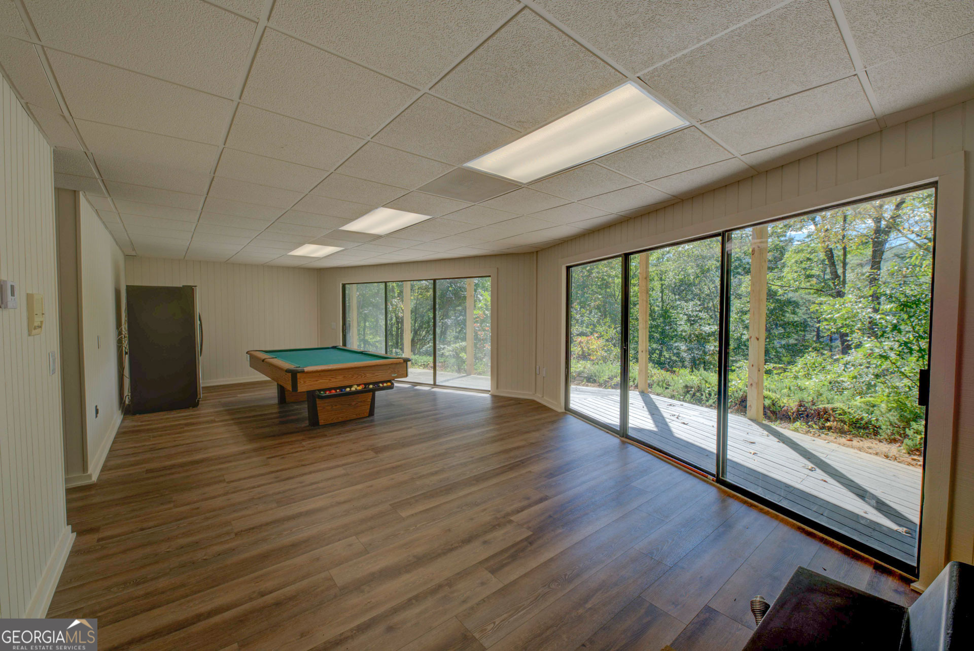 1799 Seed Lake Road Lakemont, GA 30552 - Photo 14 of 42 a view of a room with wooden floor wooden floor and a glass door