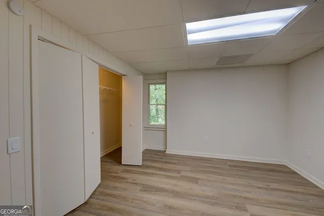 a view of an empty room and wooden floor