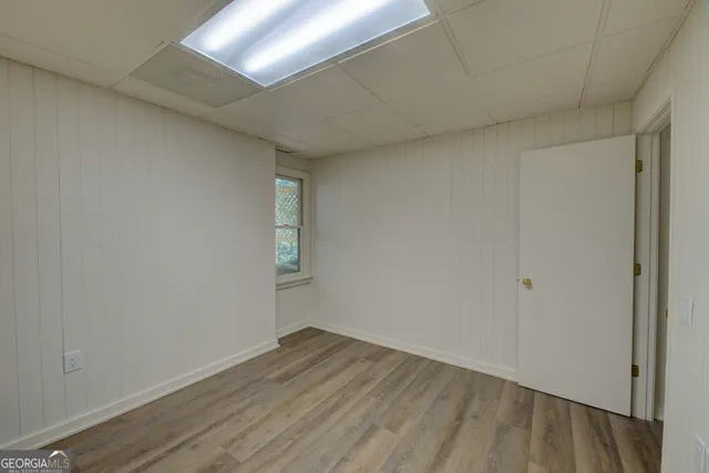 a view of a room that has wooden floor in it