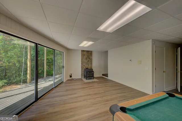 a room with a bed and wooden floor