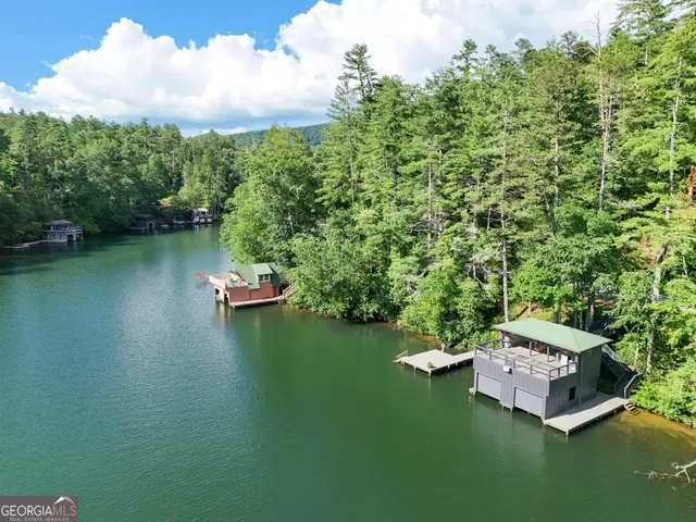a bed is sitting in the middle of a lake
