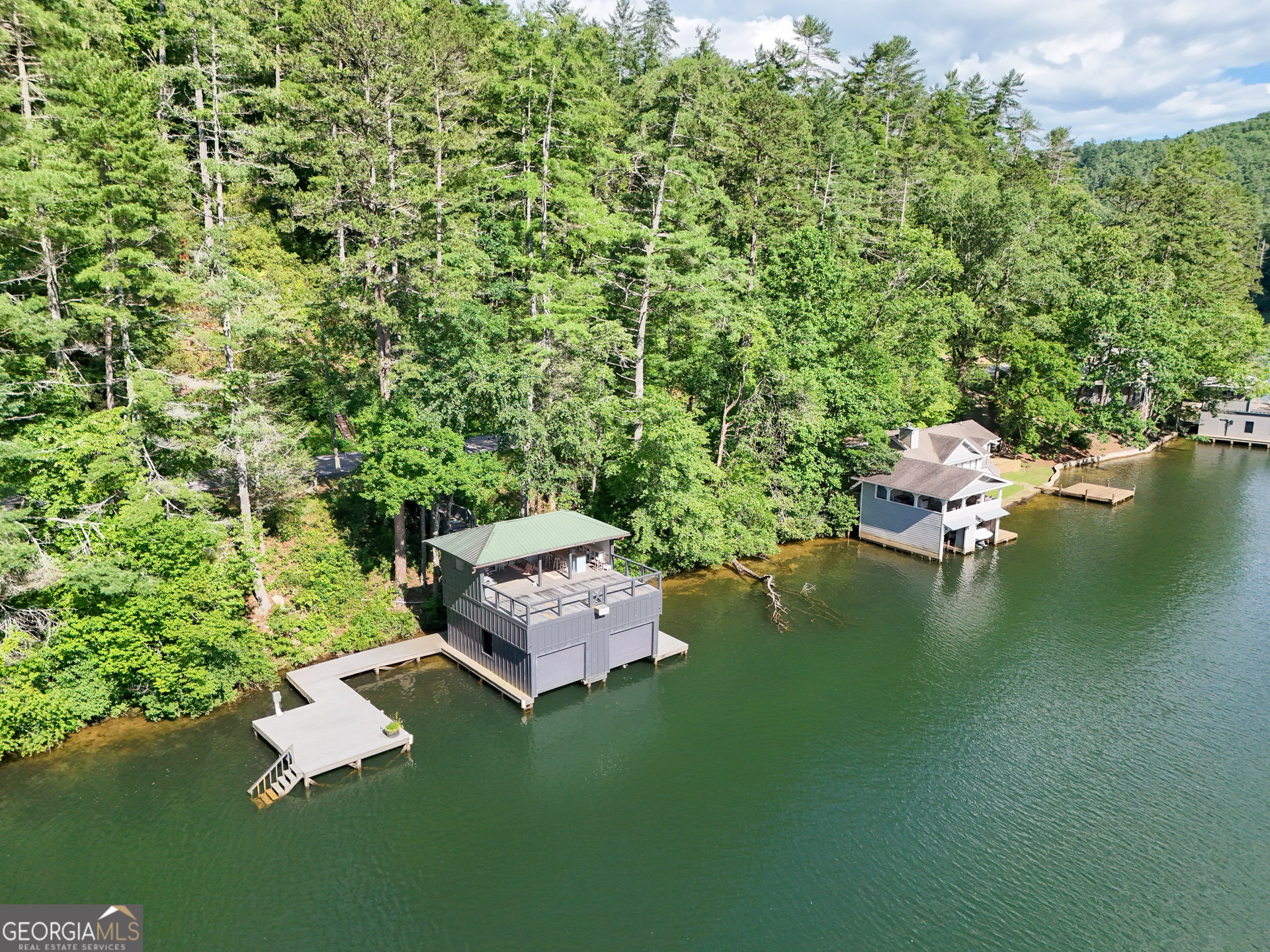 1799 Seed Lake Road Lakemont, GA 30552 - Photo 37 of 42 a swimming pool with outdoor seating and trees in the background