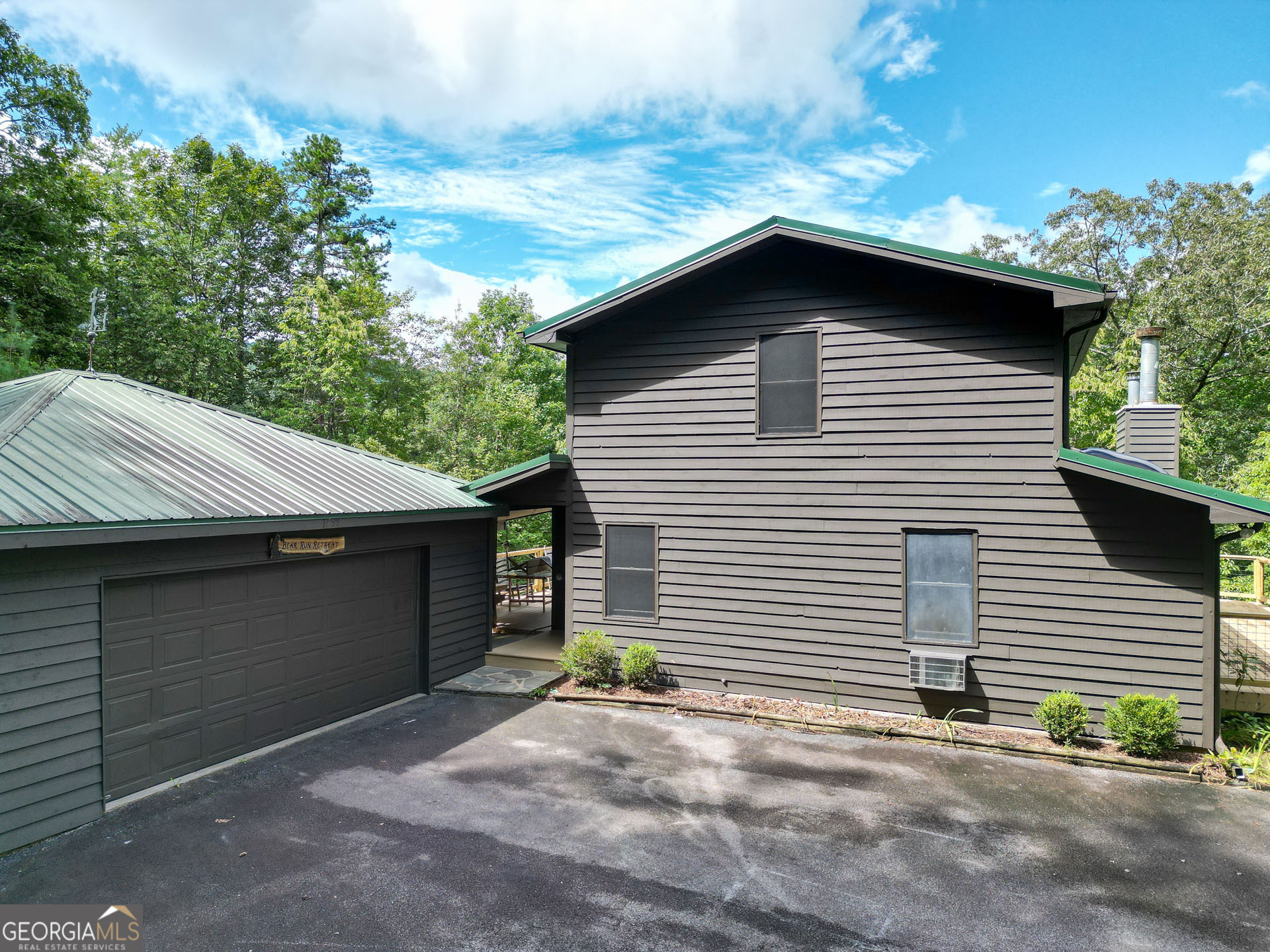 1799 Seed Lake Road Lakemont, GA 30552 - Photo 38 of 42 a house with a yard and garage