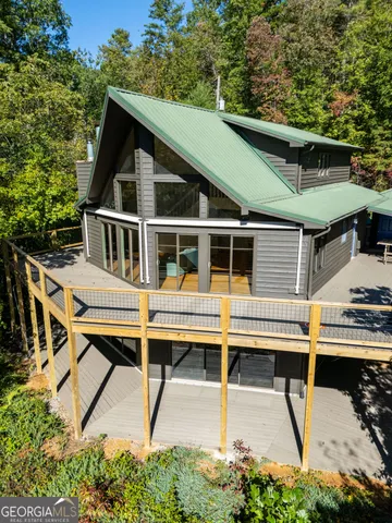 a view of balcony with wooden floor and fence