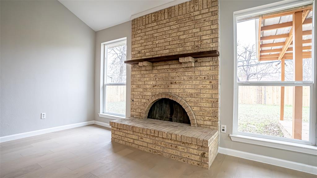 6901 Bennington Drive Watauga, TX 76148 - Photo 14 of 36 a view of living room with furniture and a fireplace