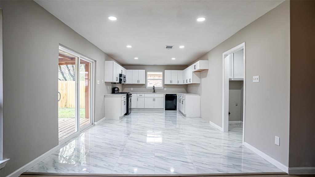 6901 Bennington Drive Watauga, TX 76148 - Photo 17 of 36 a view of kitchen with wooden floor