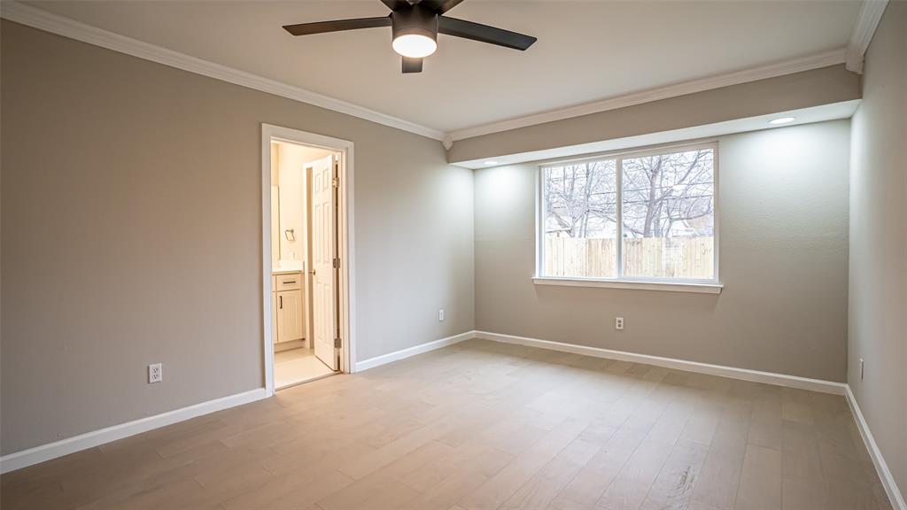 6901 Bennington Drive Watauga, TX 76148 - Photo 26 of 36 an empty room with a window and a fan