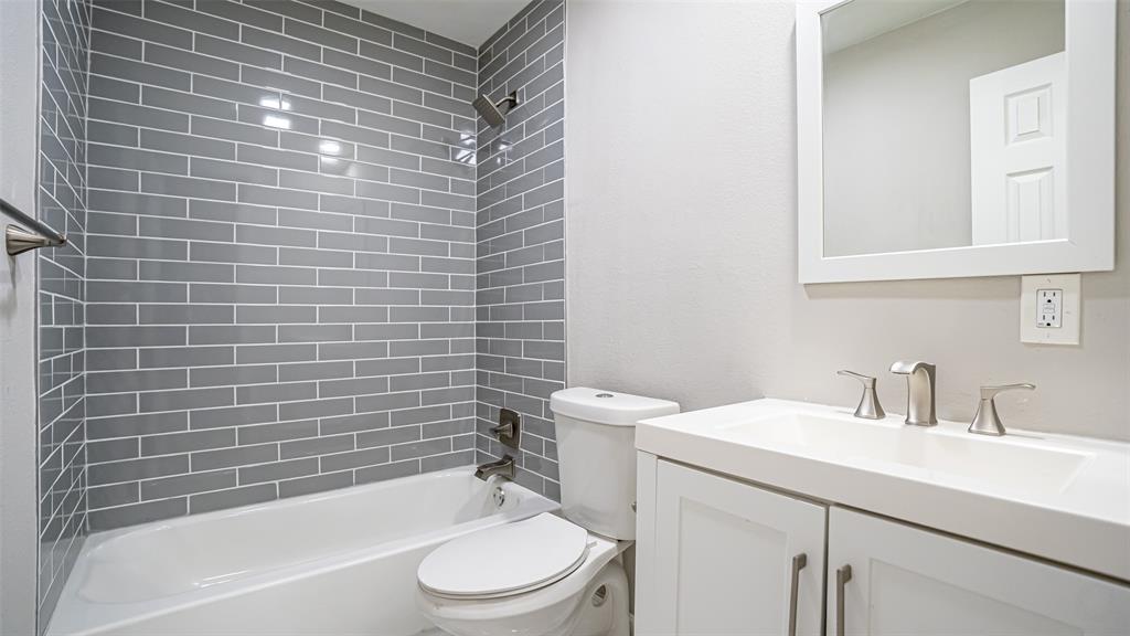 6901 Bennington Drive Watauga, TX 76148 - Photo 29 of 36 a bathroom with a sink a toilet and bathtub