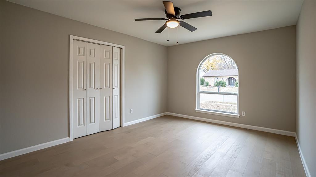 6901 Bennington Drive Watauga, TX 76148 - Photo 32 of 36 an empty room with a window and a fan