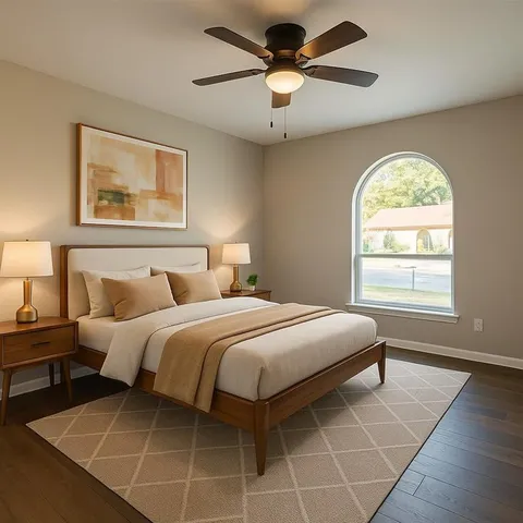 a bedroom with a large bed and a window