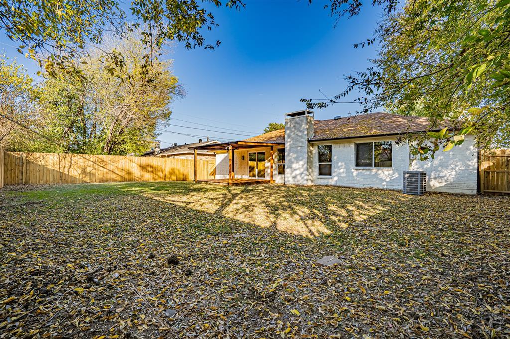 6901 Bennington Drive Watauga, TX 76148 - Photo 9 of 36 a front view of a house with a yard