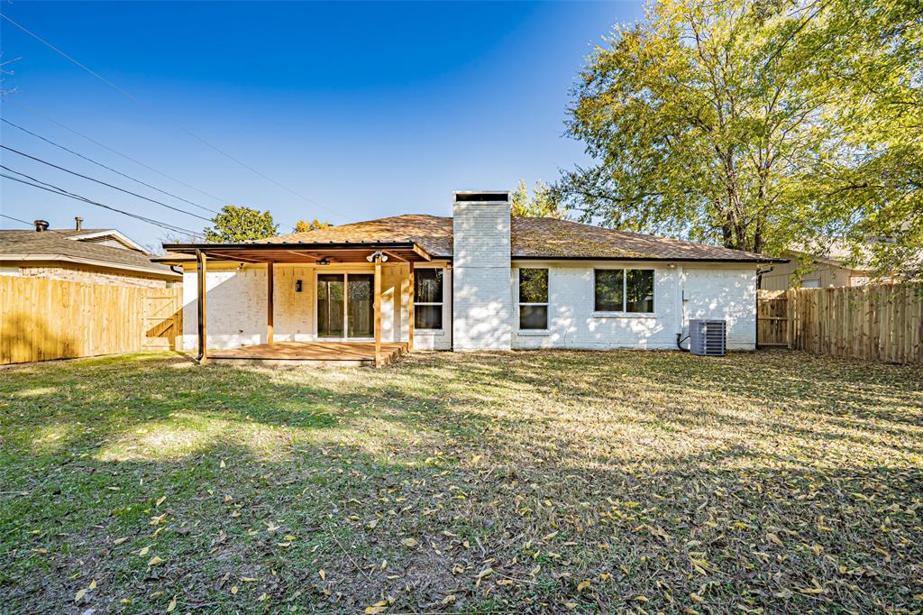 6901 Bennington Drive Watauga, TX 76148 - Photo 10 of 36 a front view of a house with a garden