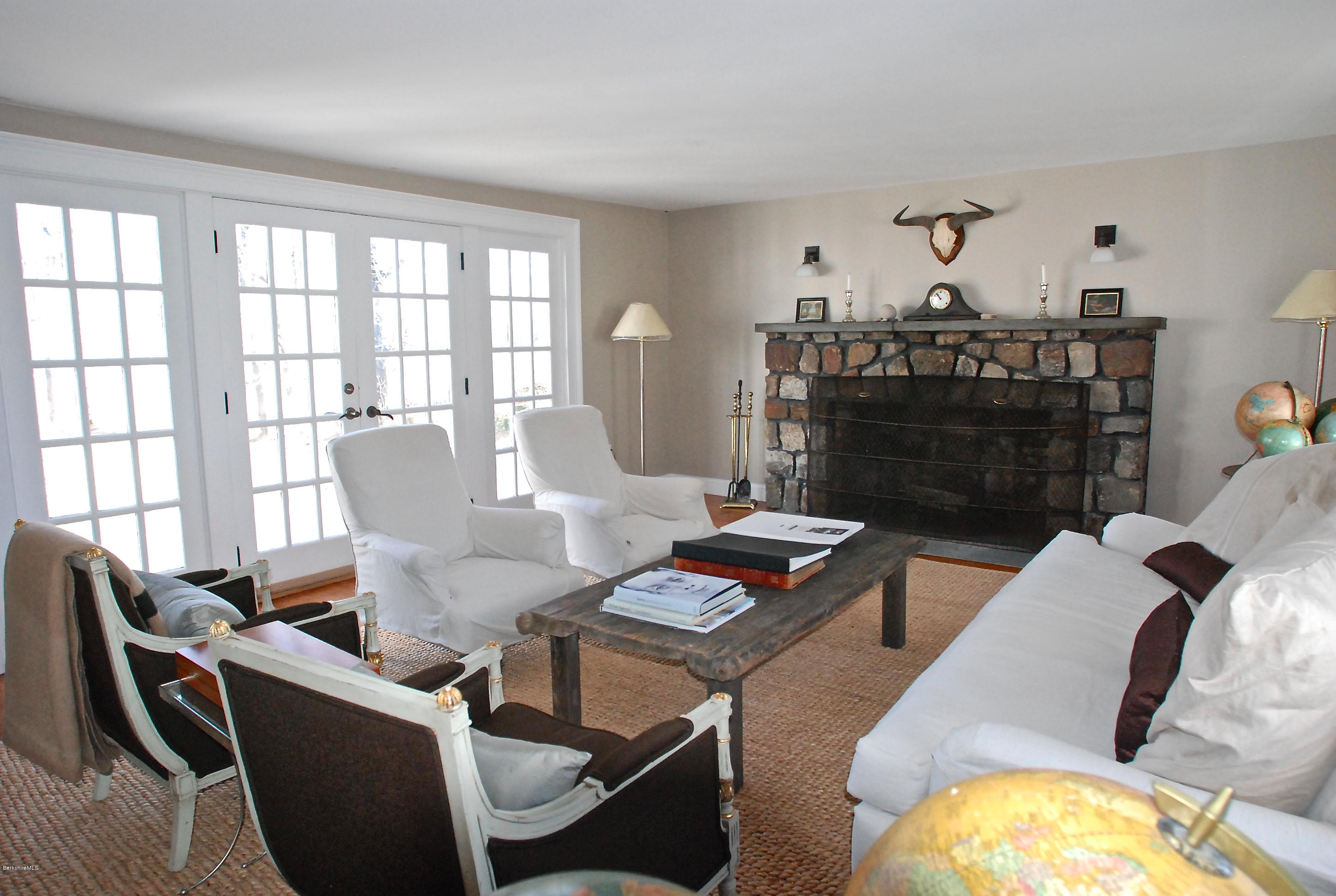 176 Sandisfield Road Sandisfield, MA 01255 - Photo 11 of 28 a living room with furniture and a fireplace