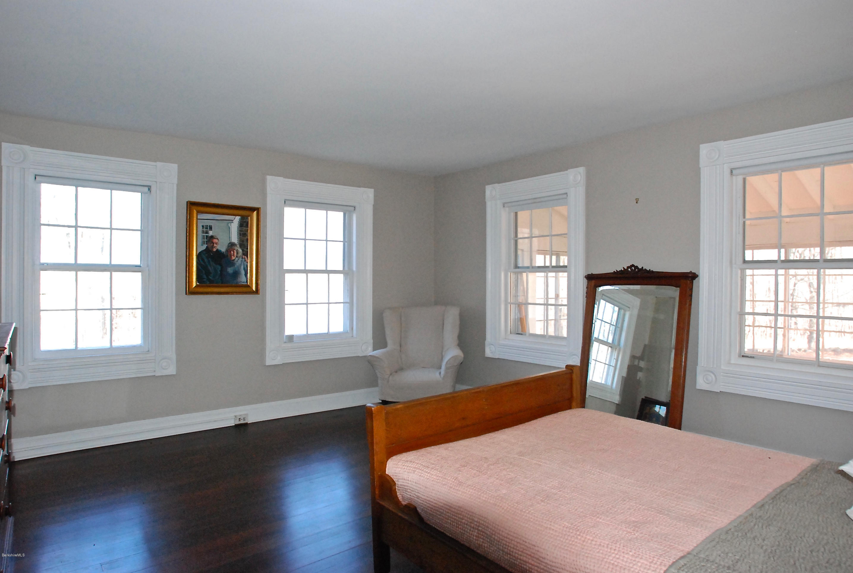 176 Sandisfield Road Sandisfield, MA 01255 - Photo 15 of 28 a bedroom with a bed and wooden floor