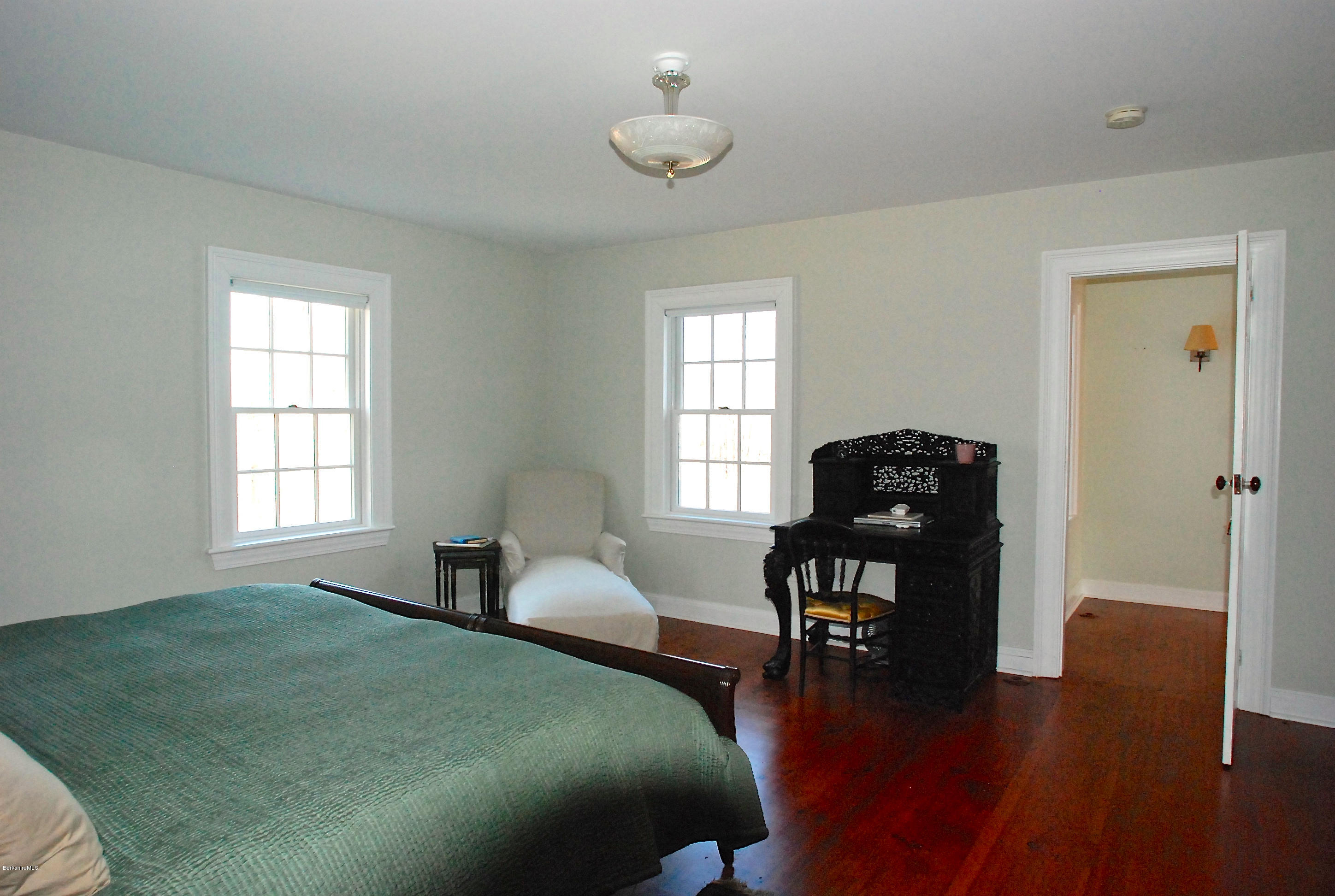176 Sandisfield Road Sandisfield, MA 01255 - Photo 16 of 28 a bedroom with a bed and a table