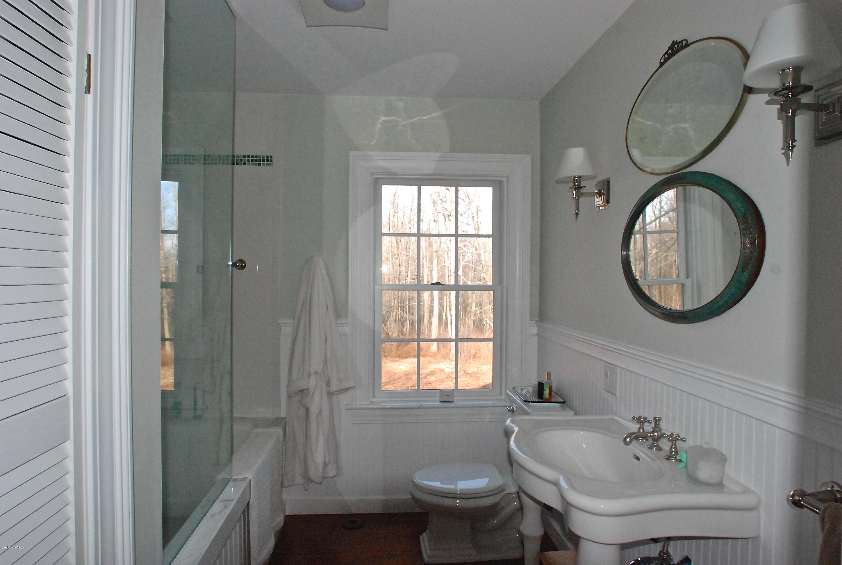 176 Sandisfield Road Sandisfield, MA 01255 - Photo 18 of 28 a bathroom with a sink a toilet and a mirror