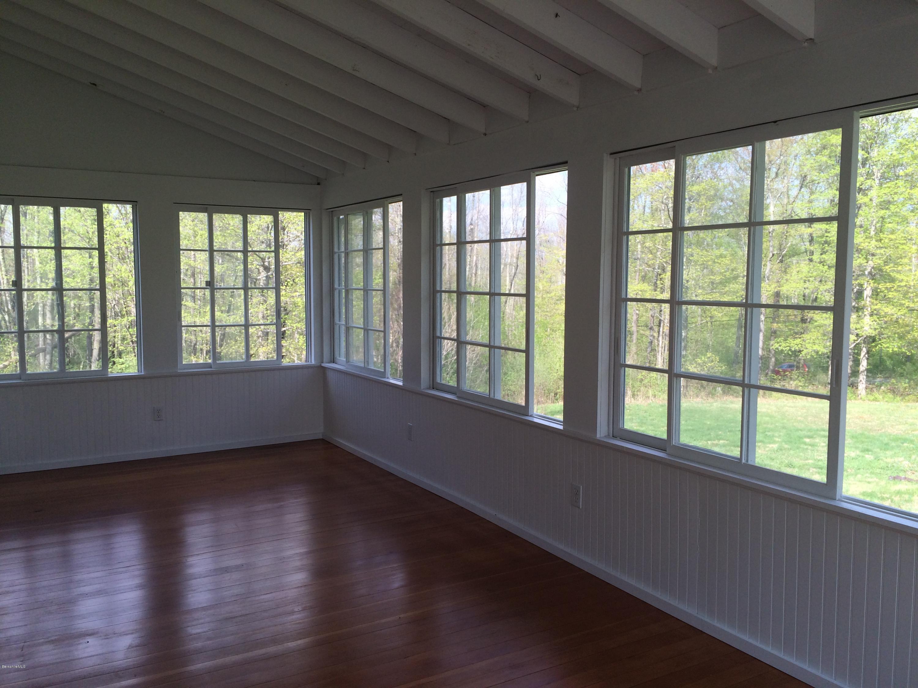 176 Sandisfield Road Sandisfield, MA 01255 - Photo 26 of 28 a view of an empty room with wooden floor and a window