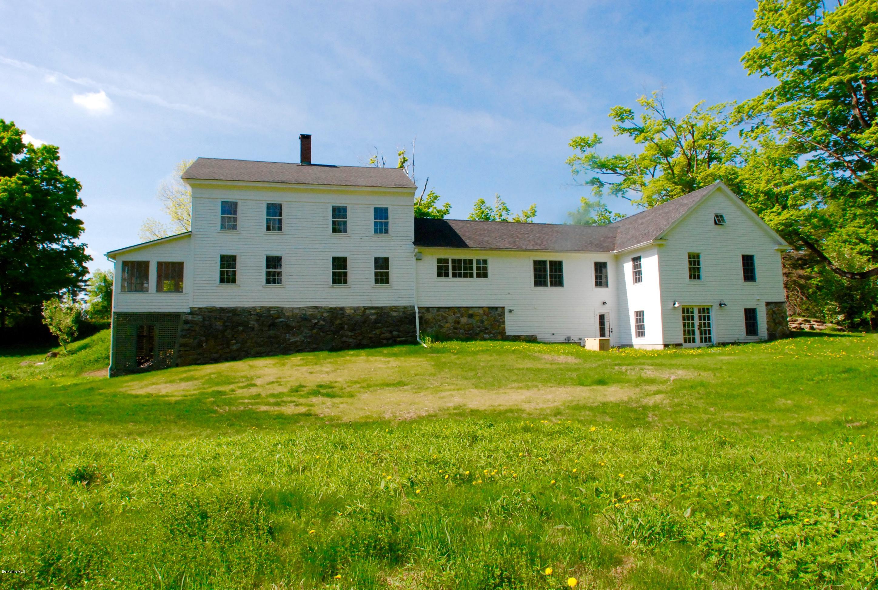 176 Sandisfield Road Sandisfield, MA 01255 - Photo 27 of 28 a front view of a house with a yard