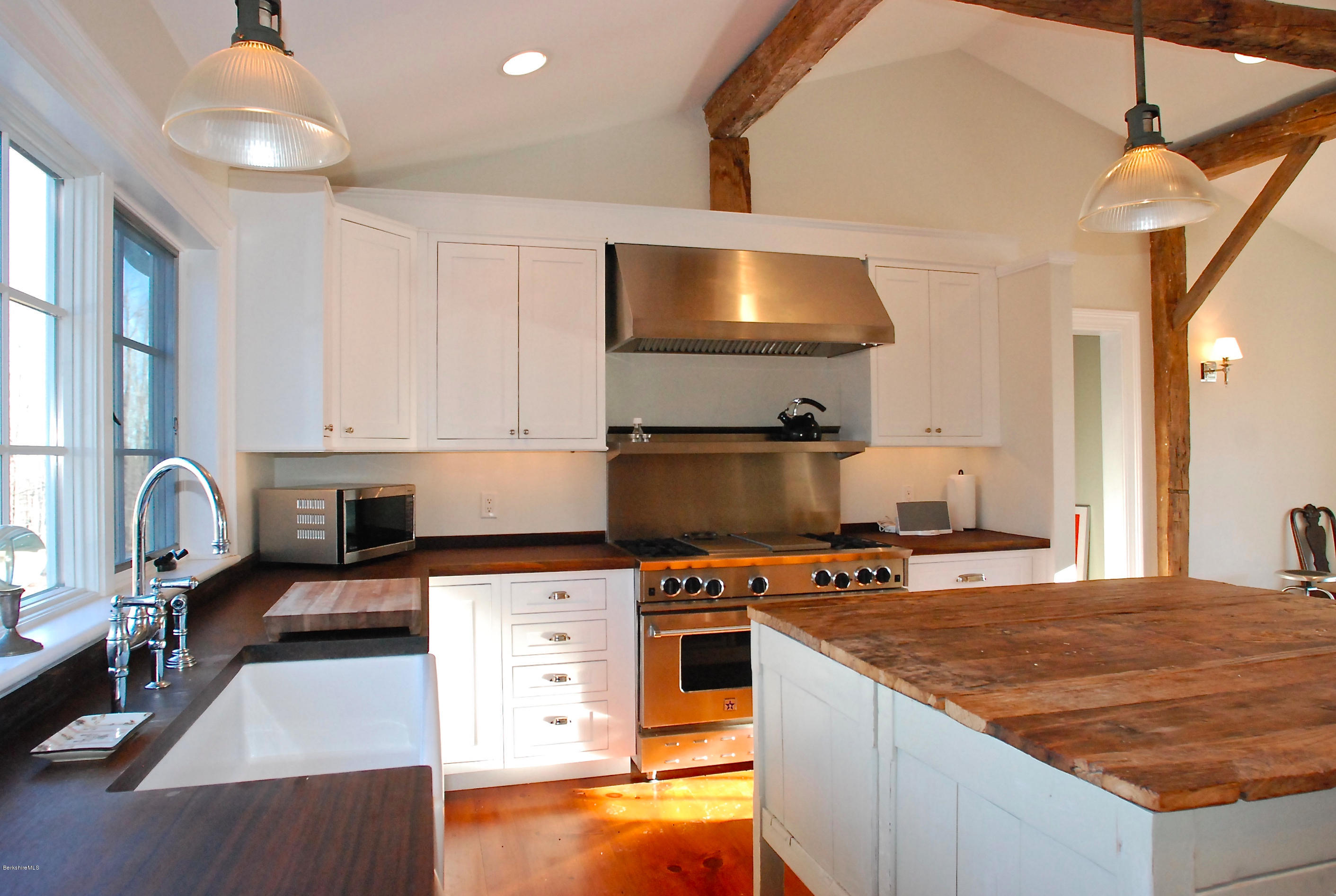 176 Sandisfield Road Sandisfield, MA 01255 - Photo 5 of 28 a kitchen with kitchen island granite countertop a stove and a sink