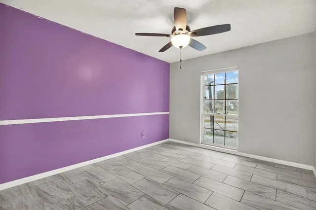 a view of an empty room with a window