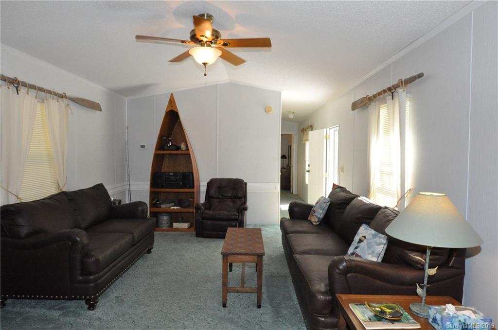 1153 Hopps Road, Unit 46 Chester, SC 29706 - Photo 10 of 22 a living room with furniture a lamp and a window