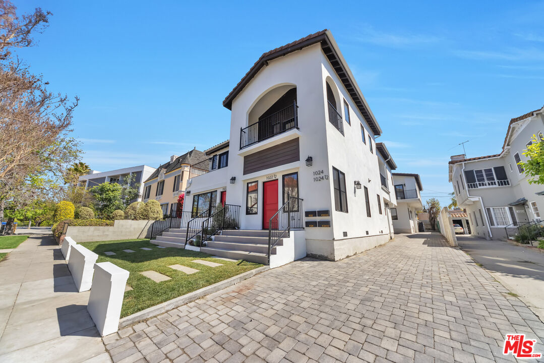 1022-1024 Masselin Avenue Los Angeles, CA 90036 - Photo 14 of 16 a front view of a building with street