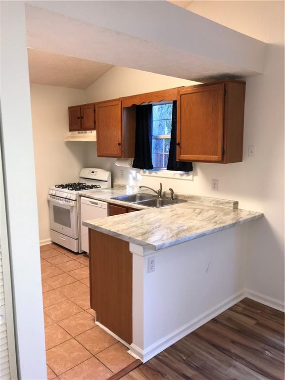 4287 Keats Court Austell, GA 30106 - Photo 5 of 20 a kitchen with stainless steel appliances granite countertop a stove a sink and a microwave