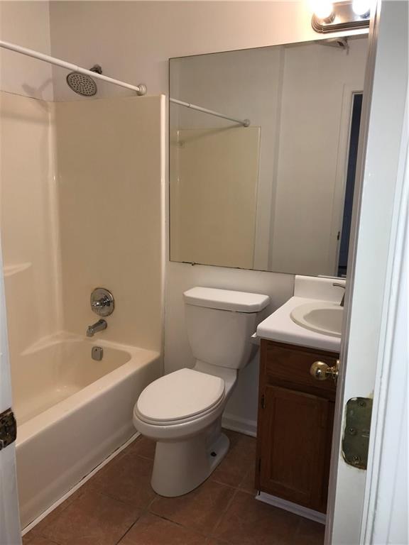 4287 Keats Court Austell, GA 30106 - Photo 8 of 20 a white toilet sitting next to a bath tub