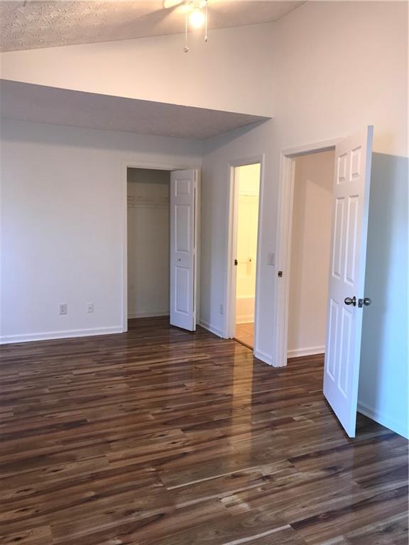 4287 Keats Court Austell, GA 30106 - Photo 10 of 20 a view of an empty room with wooden floor and a window