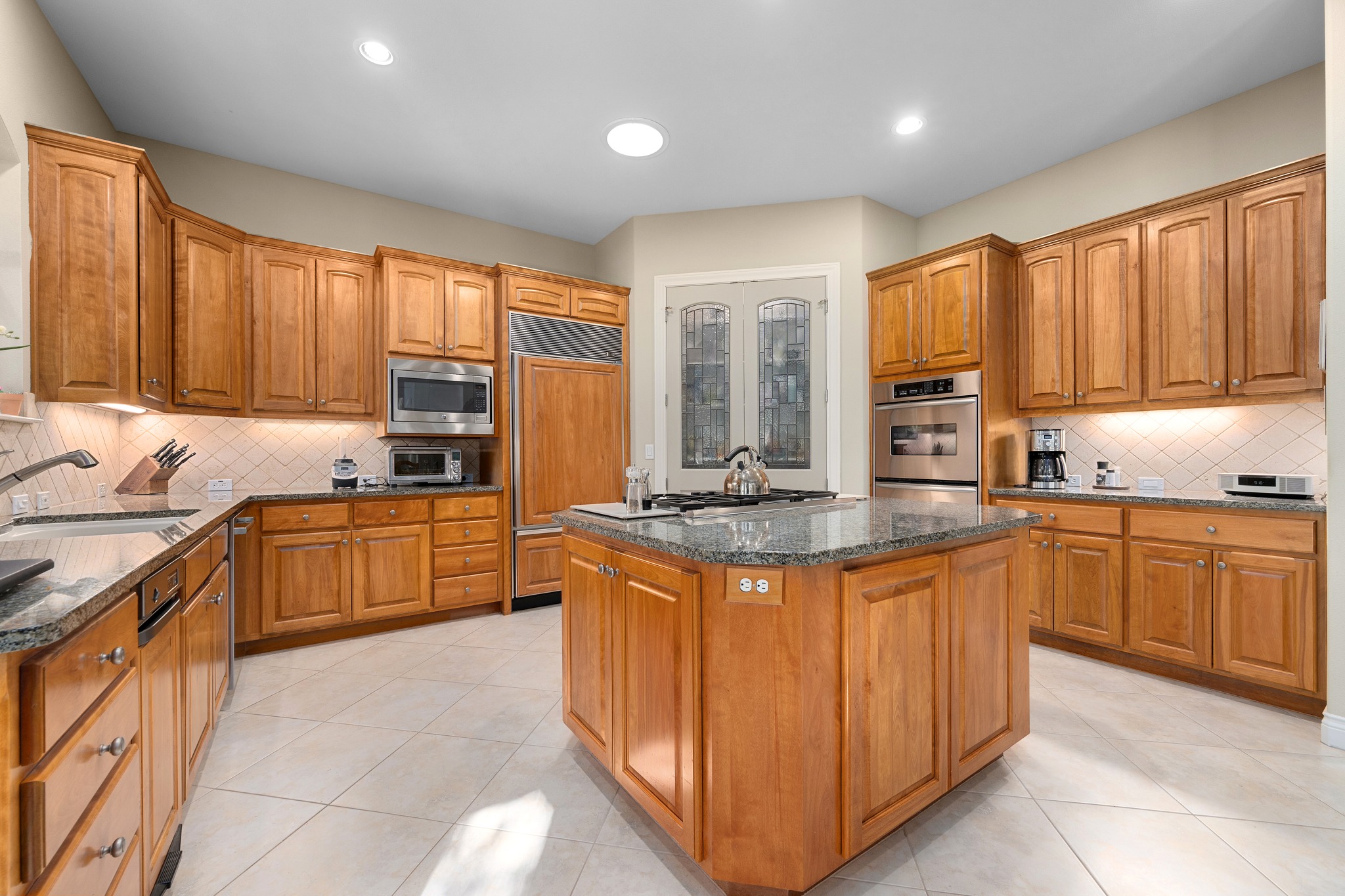 29 Meadows End Georgetown, TX 78628 - Photo 13 of 38 a kitchen with stainless steel appliances granite countertop a stove a sink dishwasher and a refrigerator