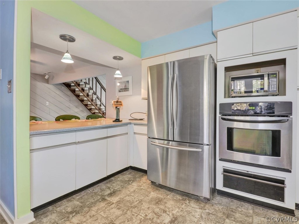 3822 Timber Ridge Road Midlothian, VA 23112 - Photo 13 of 38 a kitchen with stainless steel appliances granite countertop a refrigerator and a stove top oven