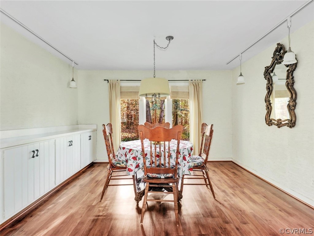 3822 Timber Ridge Road Midlothian, VA 23112 - Photo 19 of 38 a view of a dining room with furniture window and wooden floor