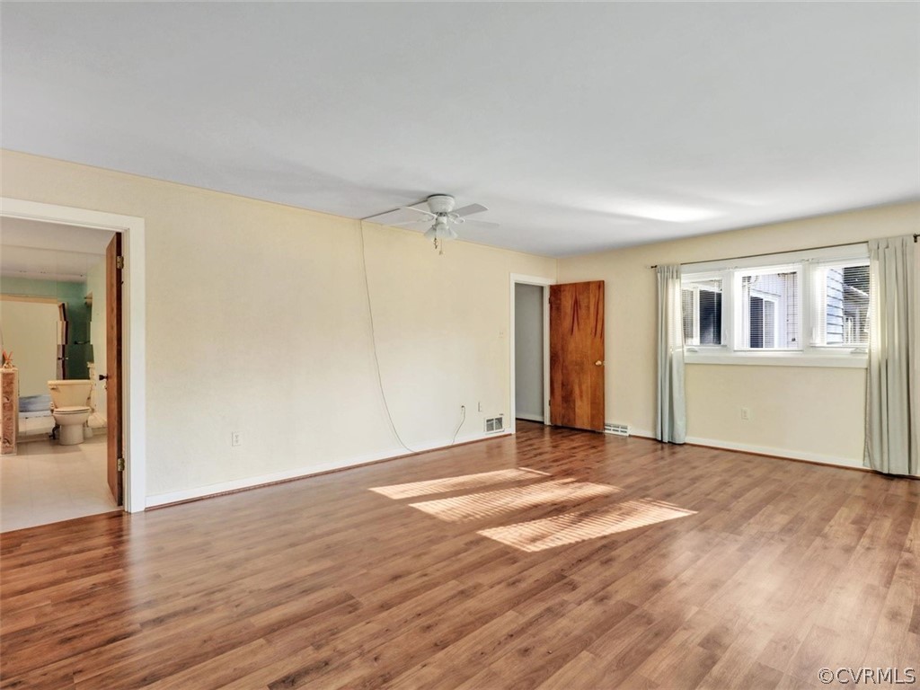 3822 Timber Ridge Road Midlothian, VA 23112 - Photo 21 of 38 a view of a livingroom with wooden floor and a bathroom