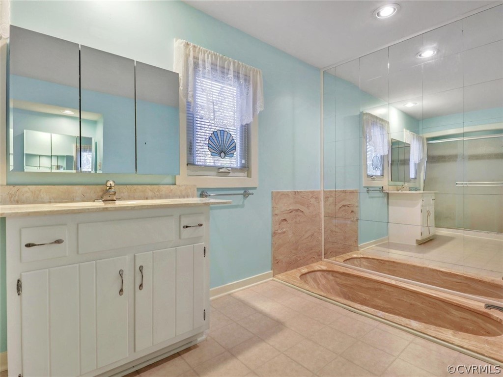 3822 Timber Ridge Road Midlothian, VA 23112 - Photo 23 of 38 a spacious bathroom with a sink double vanity and a mirror