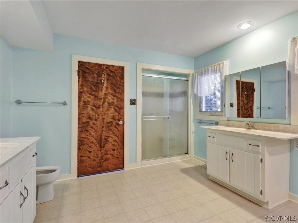 3822 Timber Ridge Road Midlothian, VA 23112 - Photo 24 of 38 a bathroom with a double vanity sink toilet and shower
