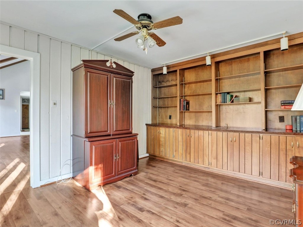 3822 Timber Ridge Road Midlothian, VA 23112 - Photo 27 of 38 a view of a livingroom with wooden floor and a ceiling fan