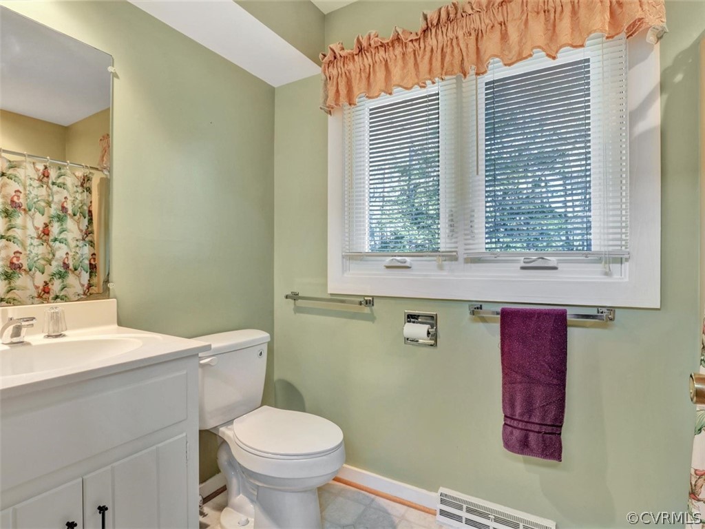 3822 Timber Ridge Road Midlothian, VA 23112 - Photo 32 of 38 a bathroom with a sink a toilet and a window