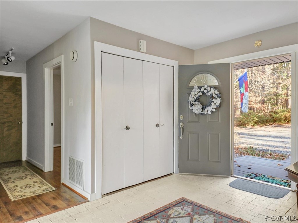 3822 Timber Ridge Road Midlothian, VA 23112 - Photo 4 of 38 a view of a hallway with a window and a kitchen