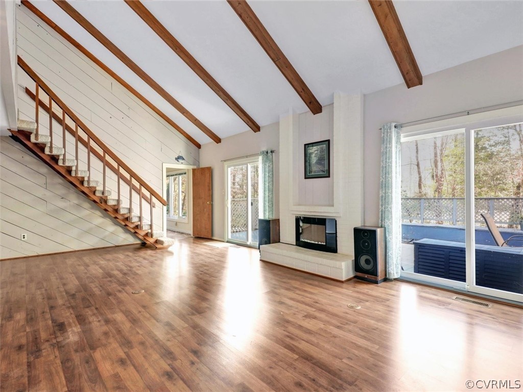3822 Timber Ridge Road Midlothian, VA 23112 - Photo 8 of 38 a view of a livingroom with wooden floor and a fireplace