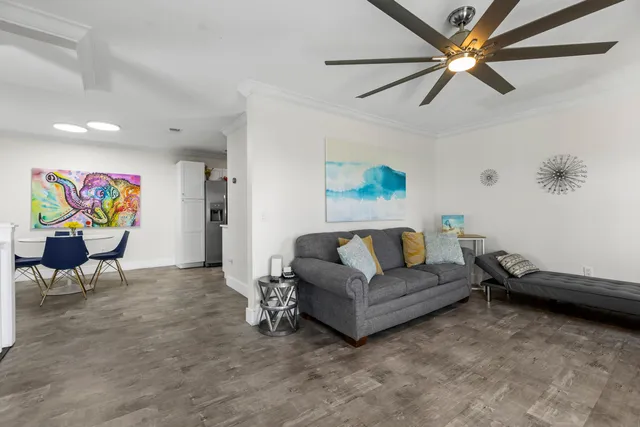 a living room with furniture and a rug
