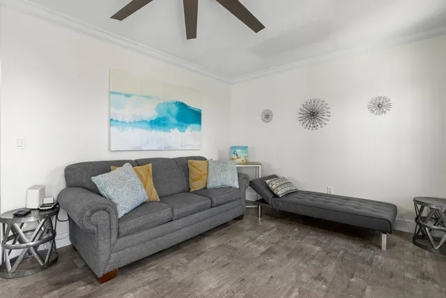 a living room with furniture and a rug