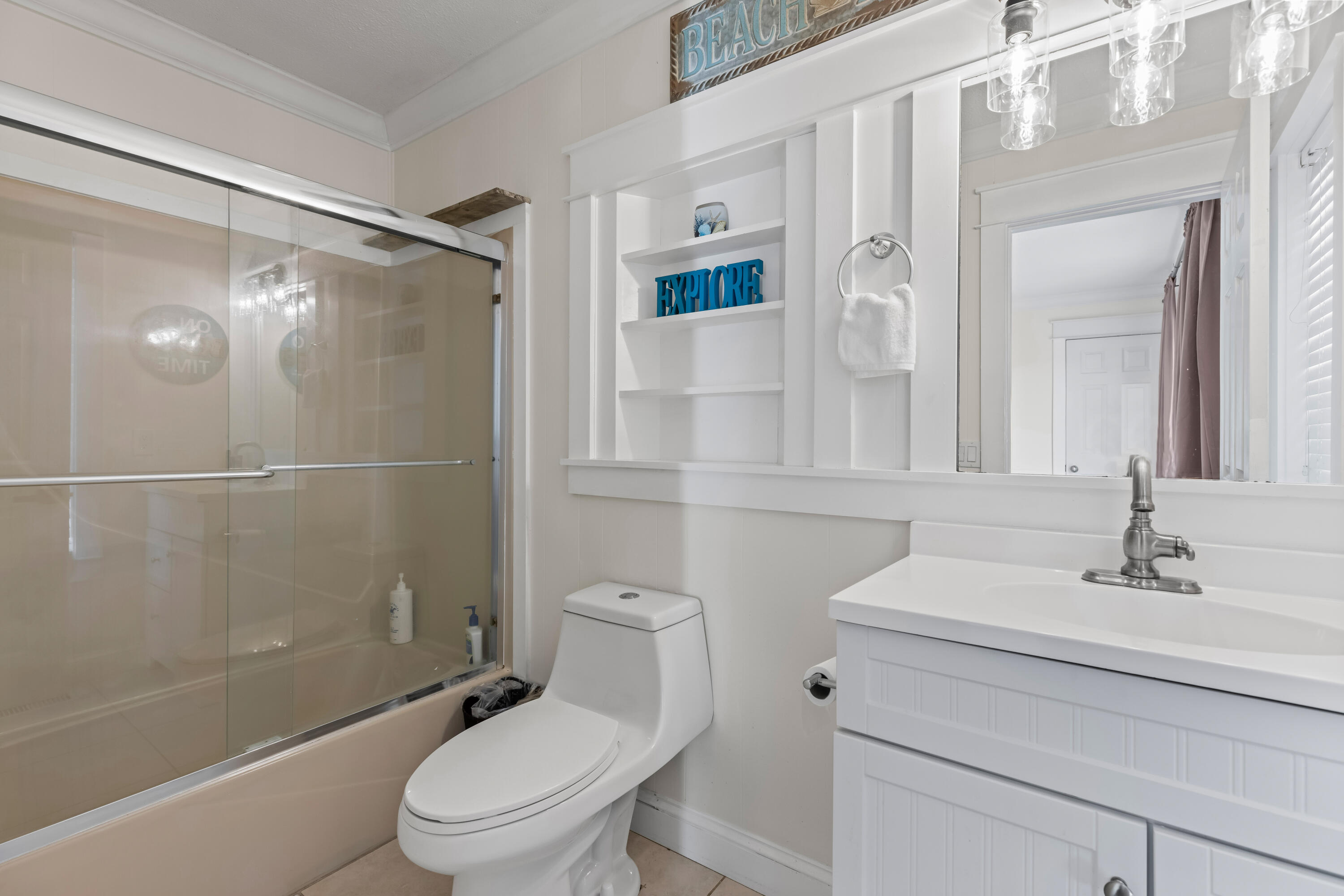 22 Moreno Point Road, Unit 3 Destin, FL 32541 - Photo 27 of 43 a bathroom with a sink toilet and shower