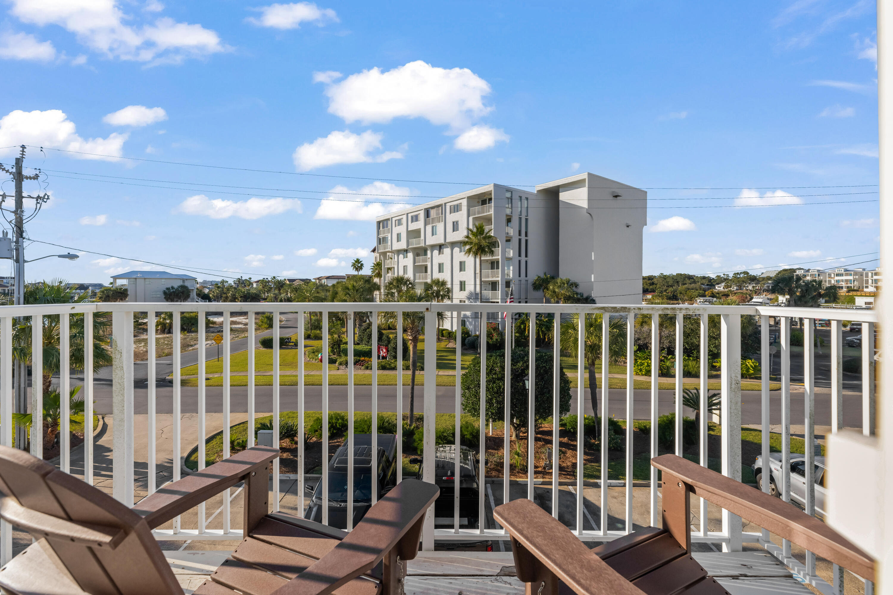 22 Moreno Point Road, Unit 3 Destin, FL 32541 - Photo 28 of 43 a view of a balcony with wooden floor