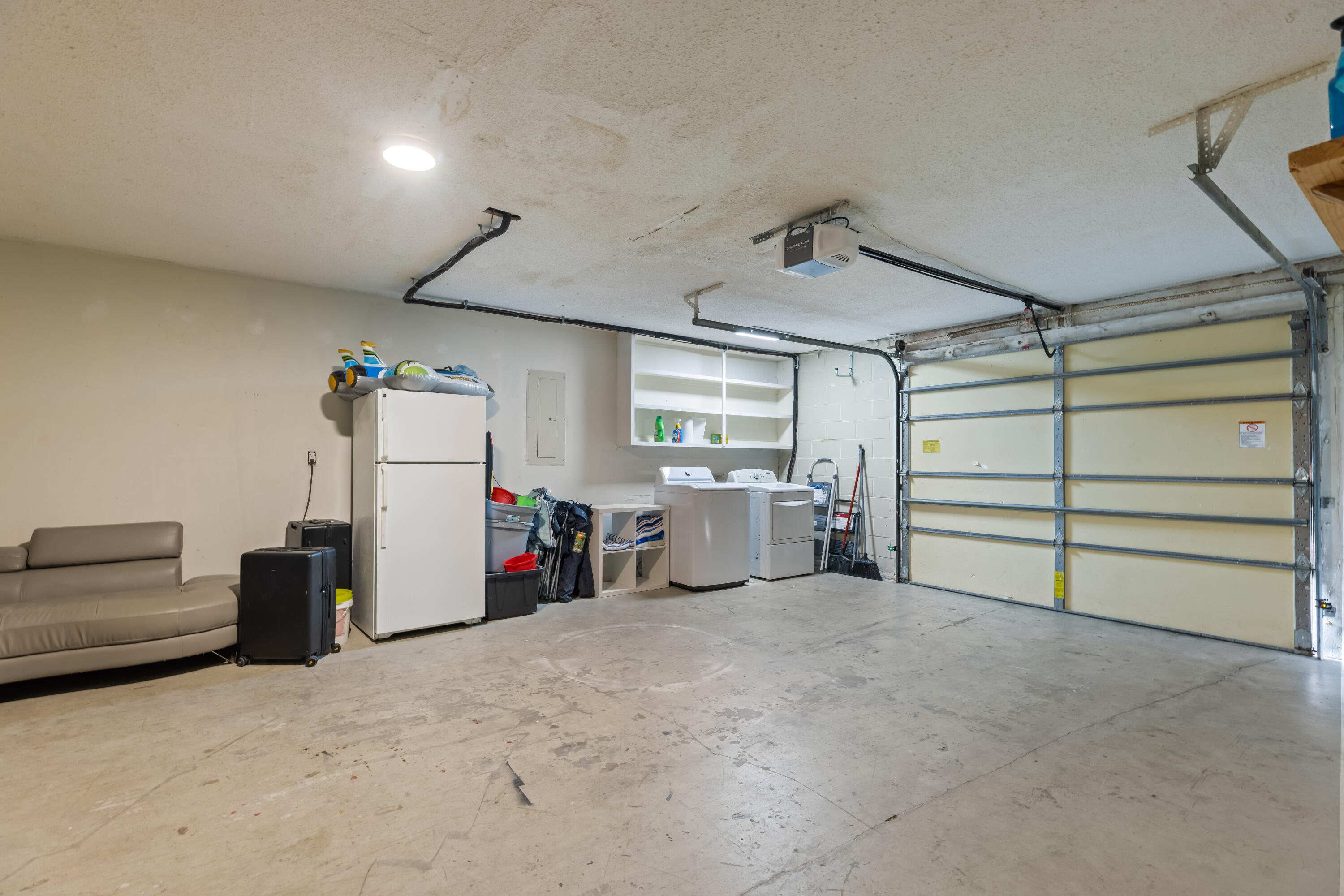 22 Moreno Point Road, Unit 3 Destin, FL 32541 - Photo 37 of 43 a view of a livingroom with furniture and a refrigerator