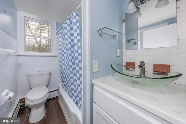 a bathroom with a toilet and a sink