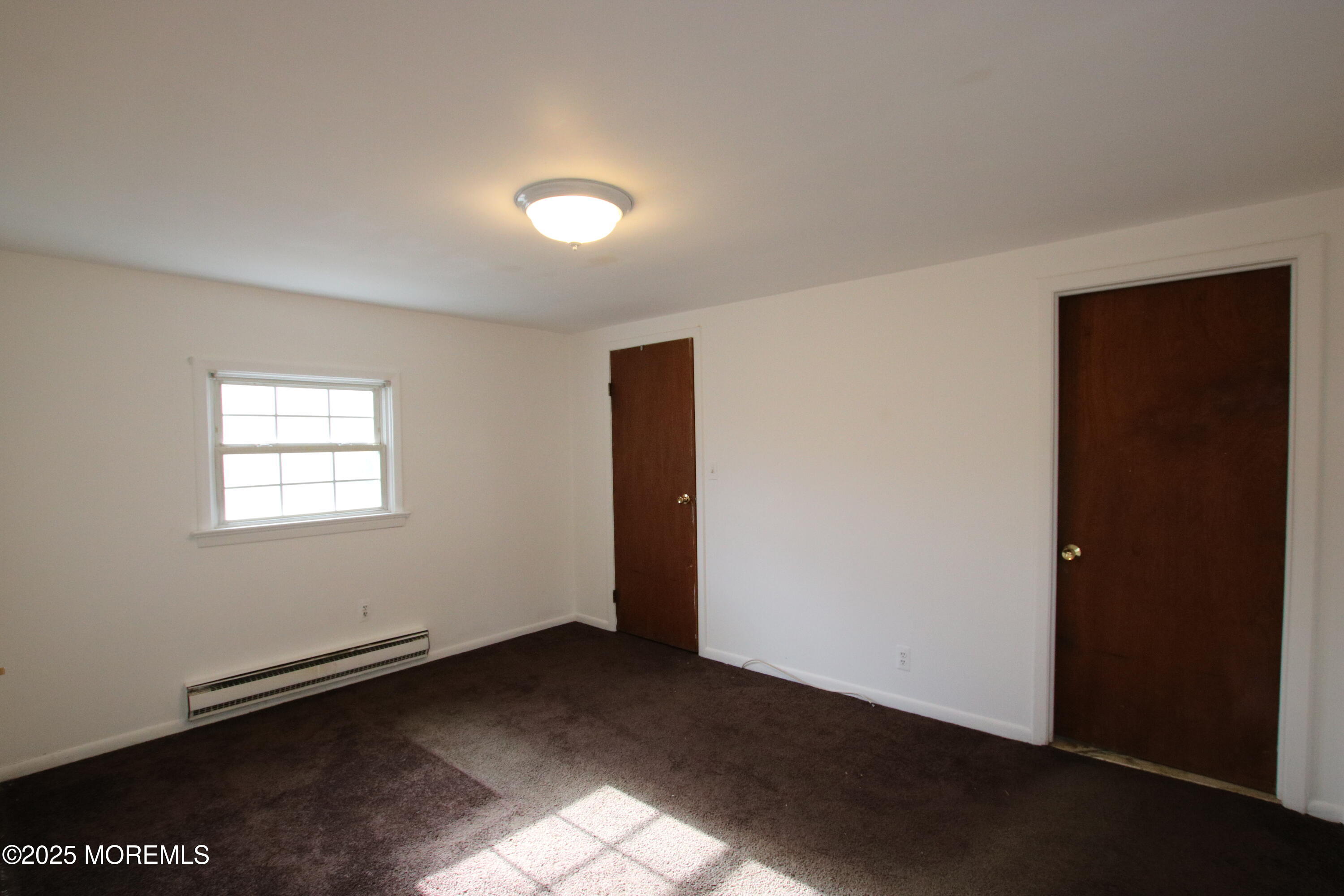 185 Monmouth Road West Long Branch, NJ 07764 - Photo 22 of 28 an empty room with a door