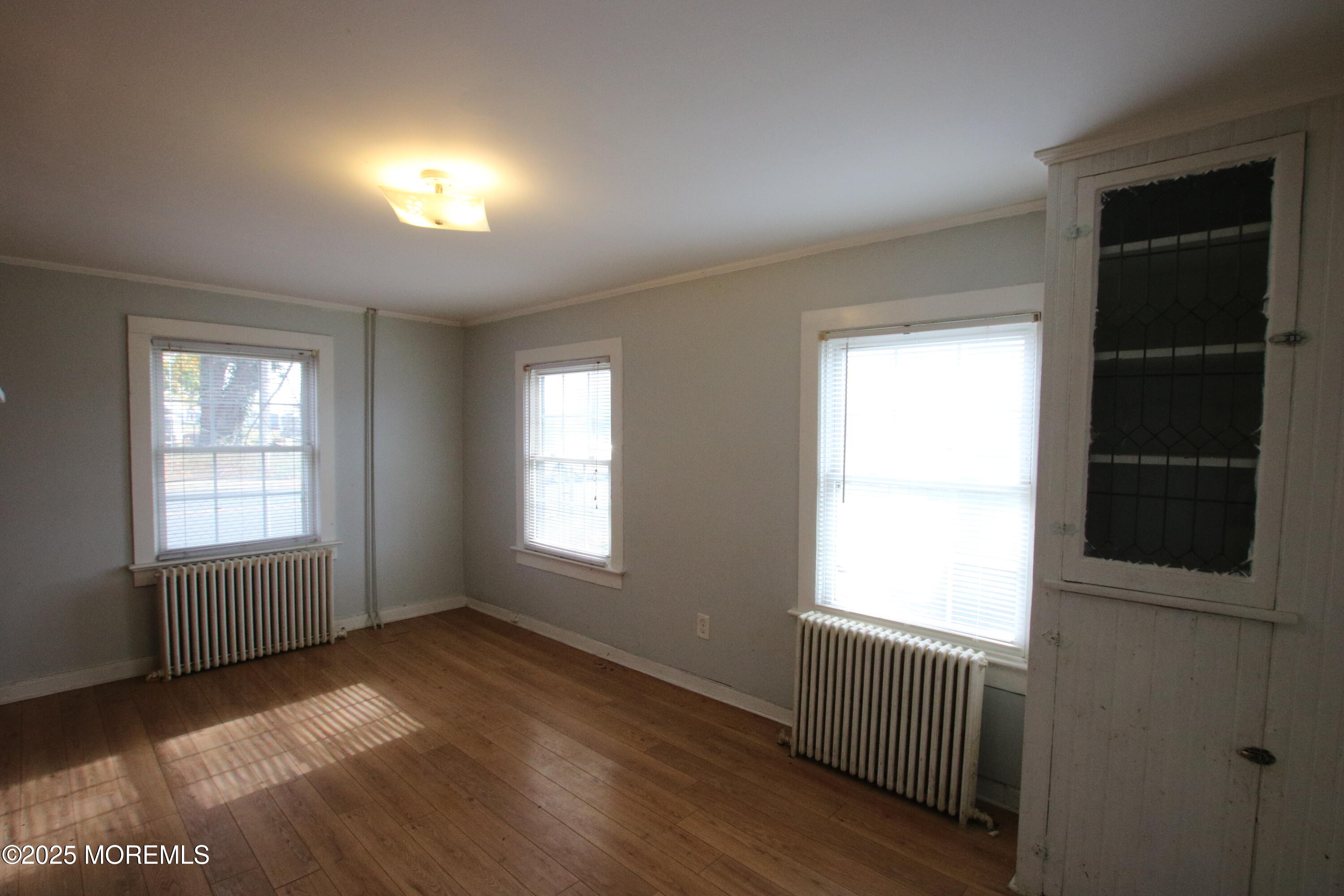 185 Monmouth Road West Long Branch, NJ 07764 - Photo 6 of 28 an empty room with windows